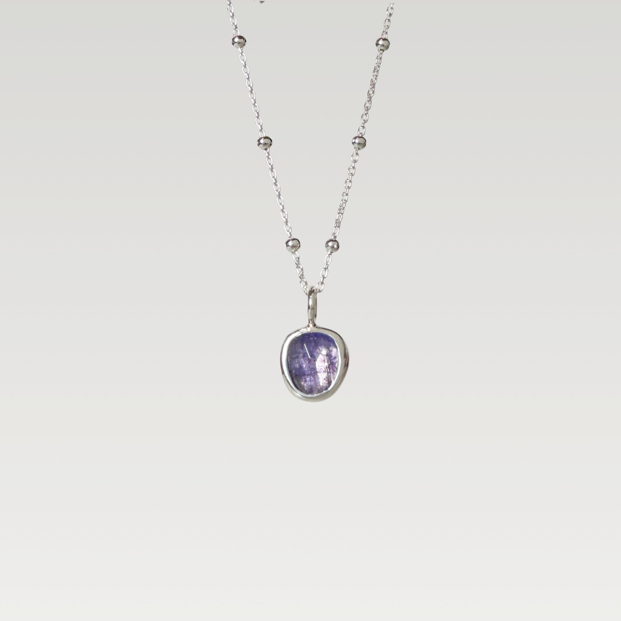 Erin DeLuca Jewelry Winter 25 tanzanite pendant.jpg