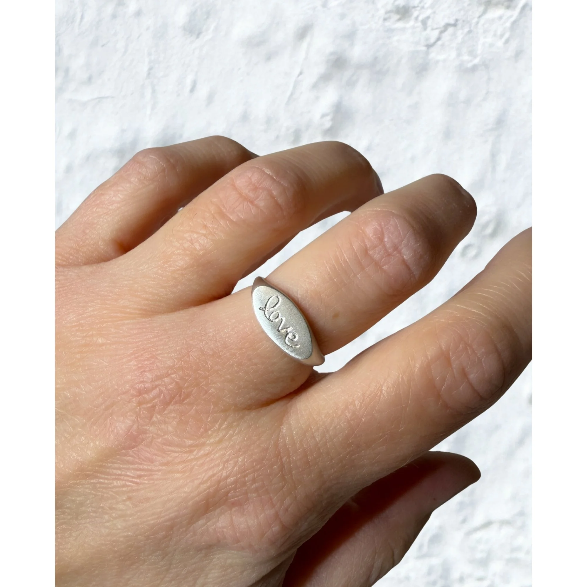 Erin DeLuca Jewelry Winter 25 love signet rings.jpg