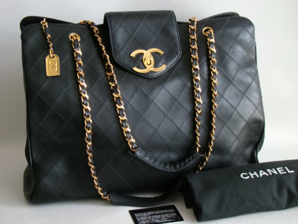The Vintage Chanel Black XL Jumbo Weekender Overnighter Travel Tote Bag. Hellllloooo you need a bag to carry your things in to your Bestie date. This bag is HUGE by the way. 