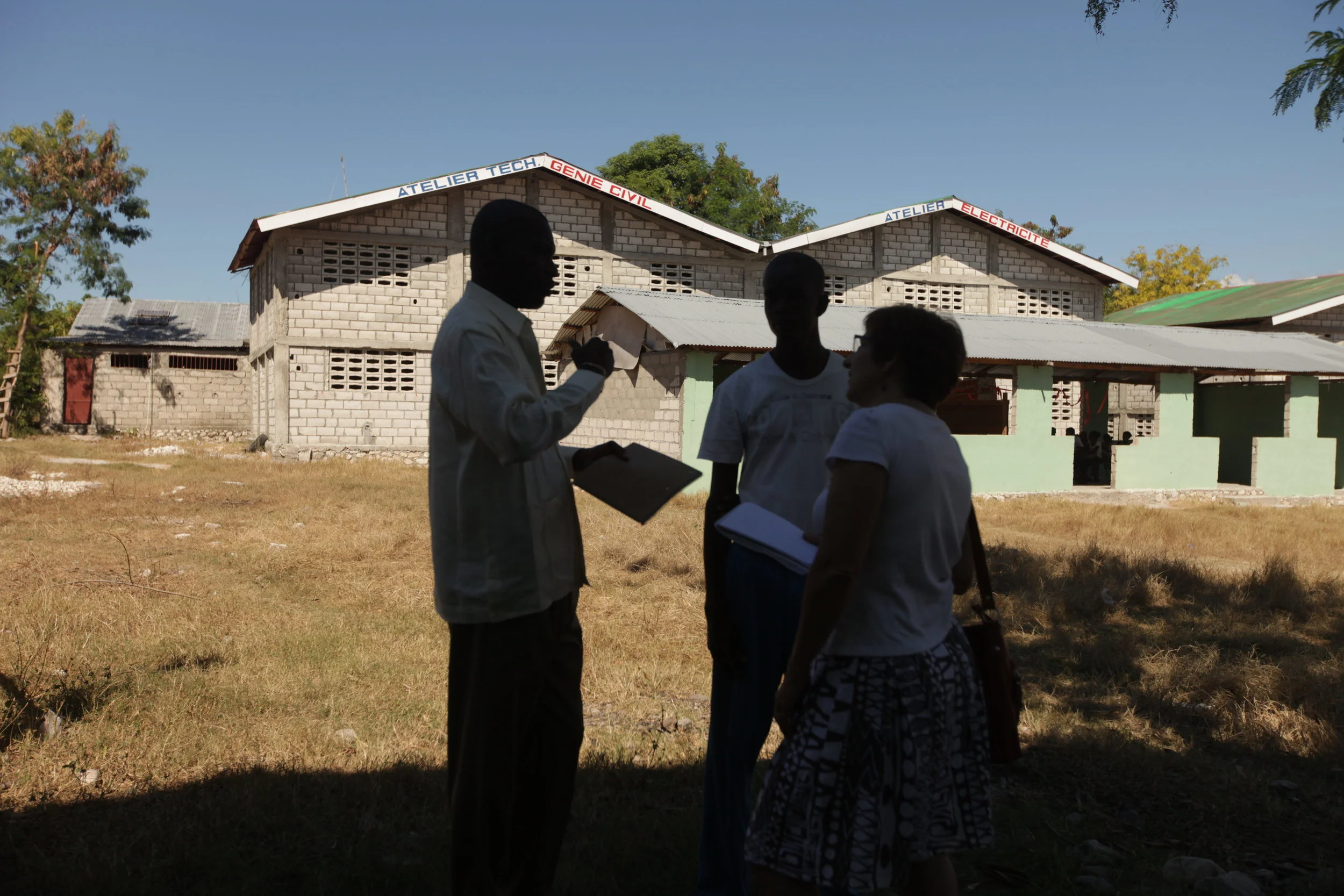 MCC U.S. News Coordinator Linda Espenshade interviews Groupe d'Accord Solidarité Action (GASA) school administrator Ramel Altidort.