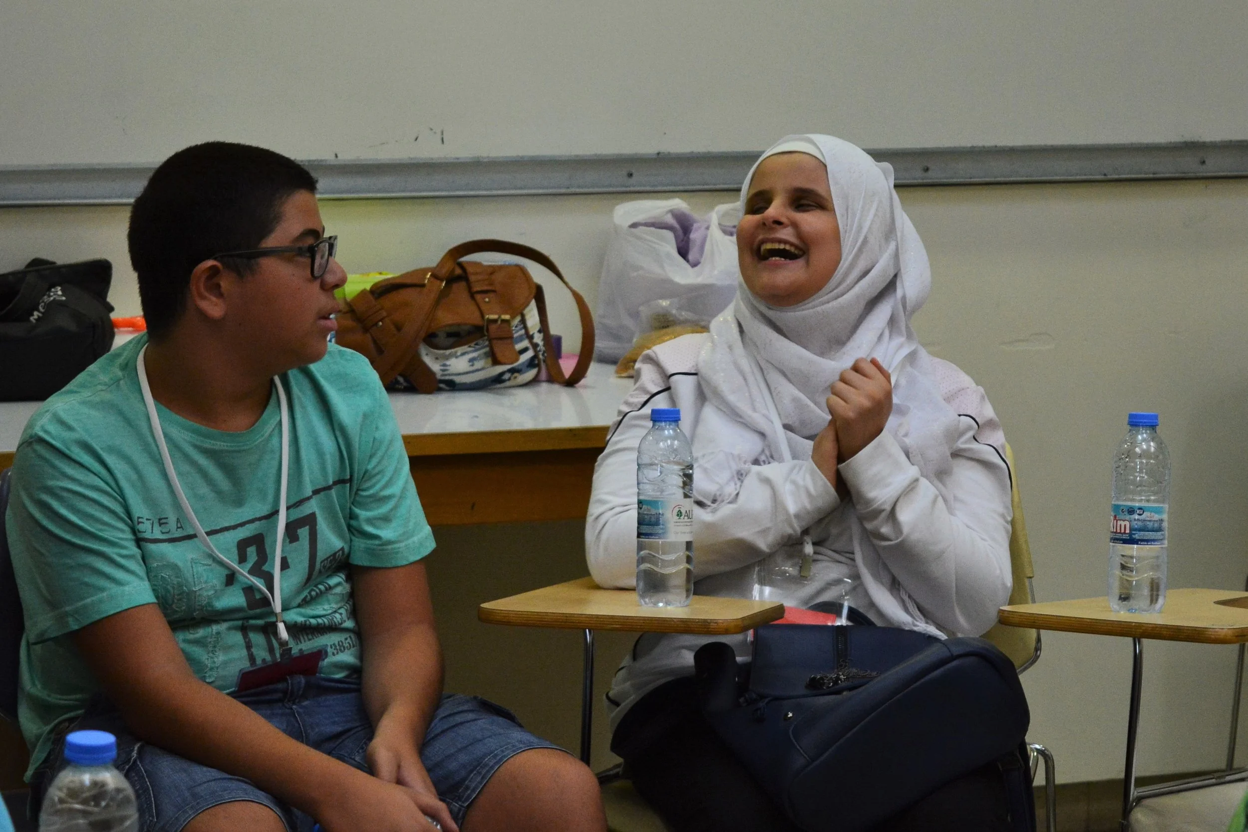 In the picture: a female participant (right) laughs alongside a male participant (left).