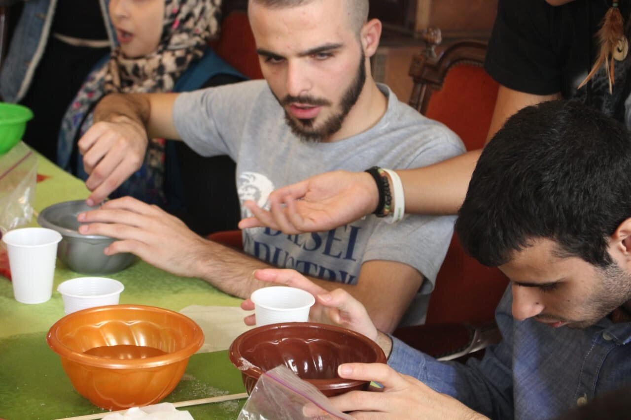 children doing experiments with volunteers