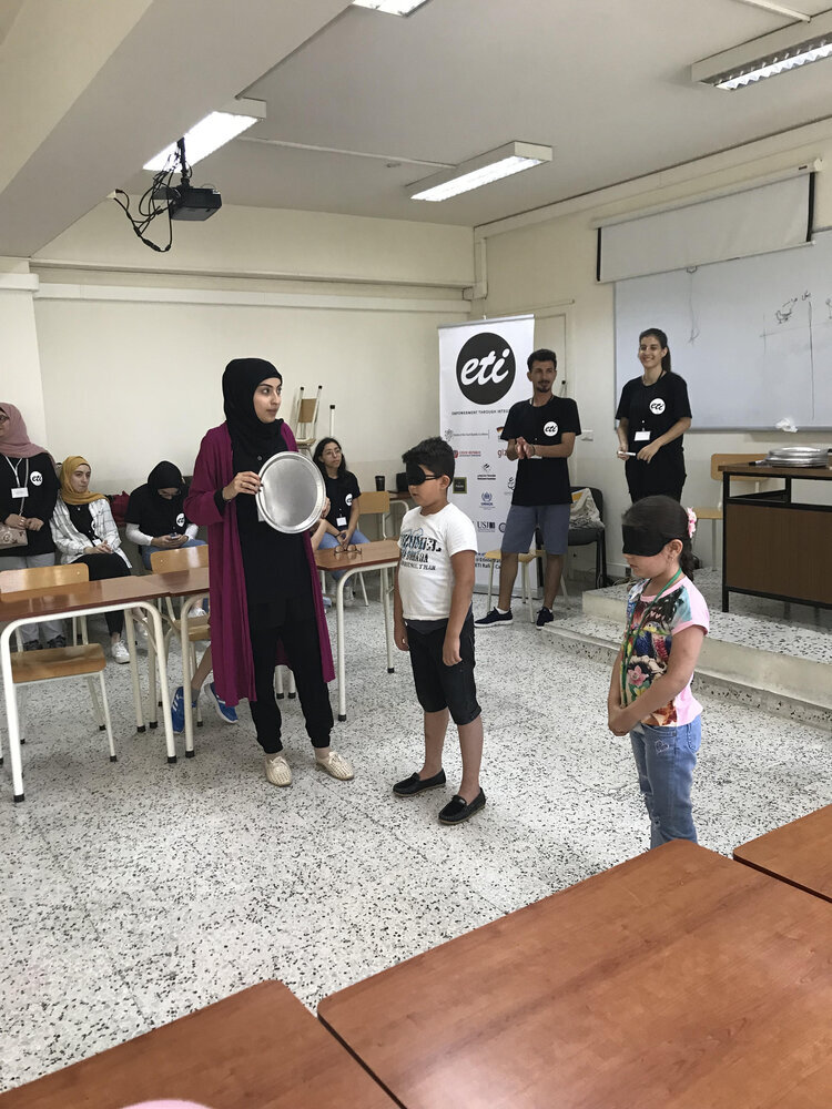 children doing activities with a volunteer