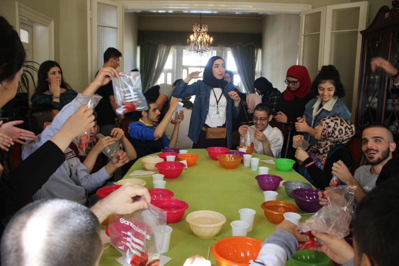 group of children and volunteers co-experimenting.jpg