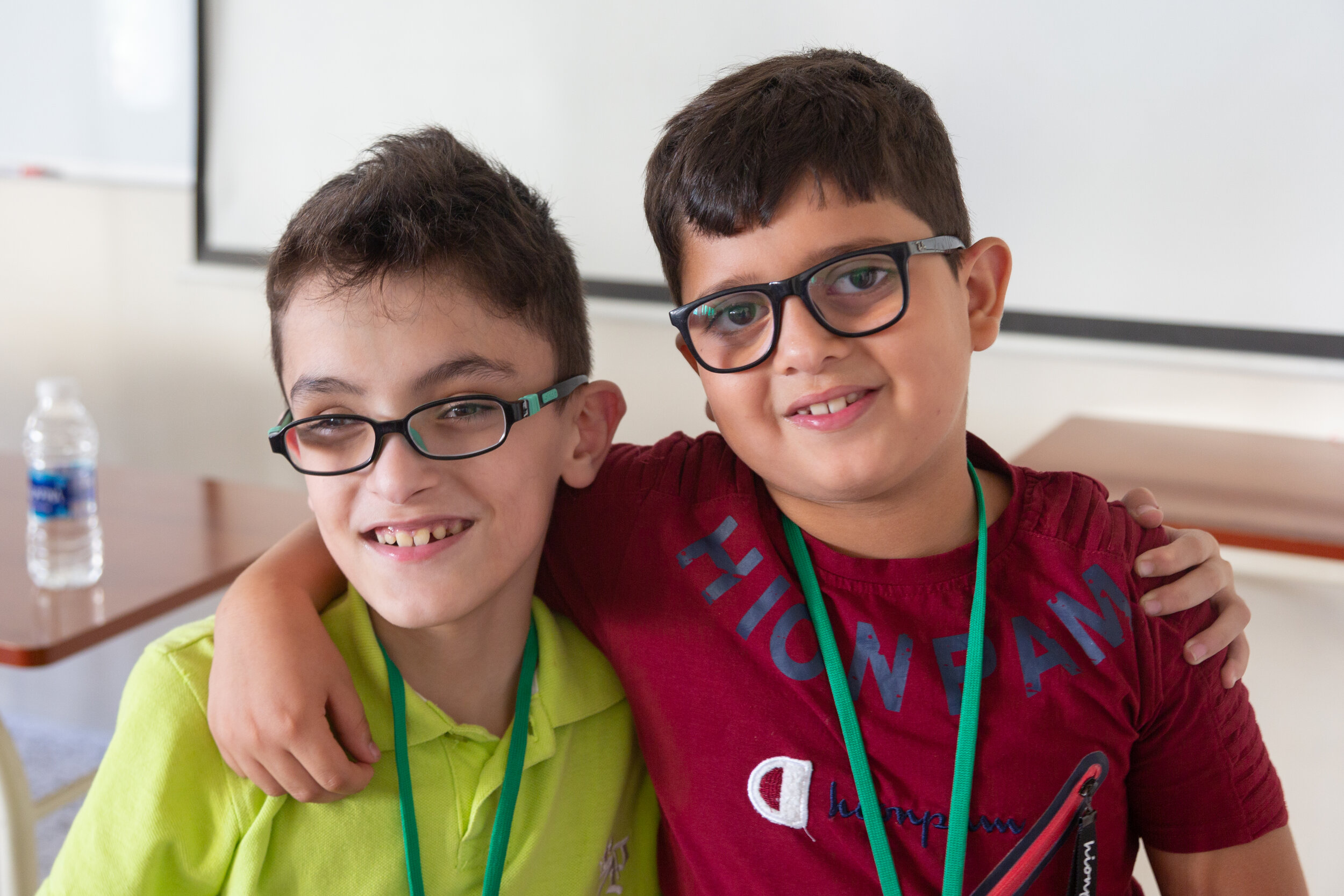 2 young participants pose for a photo