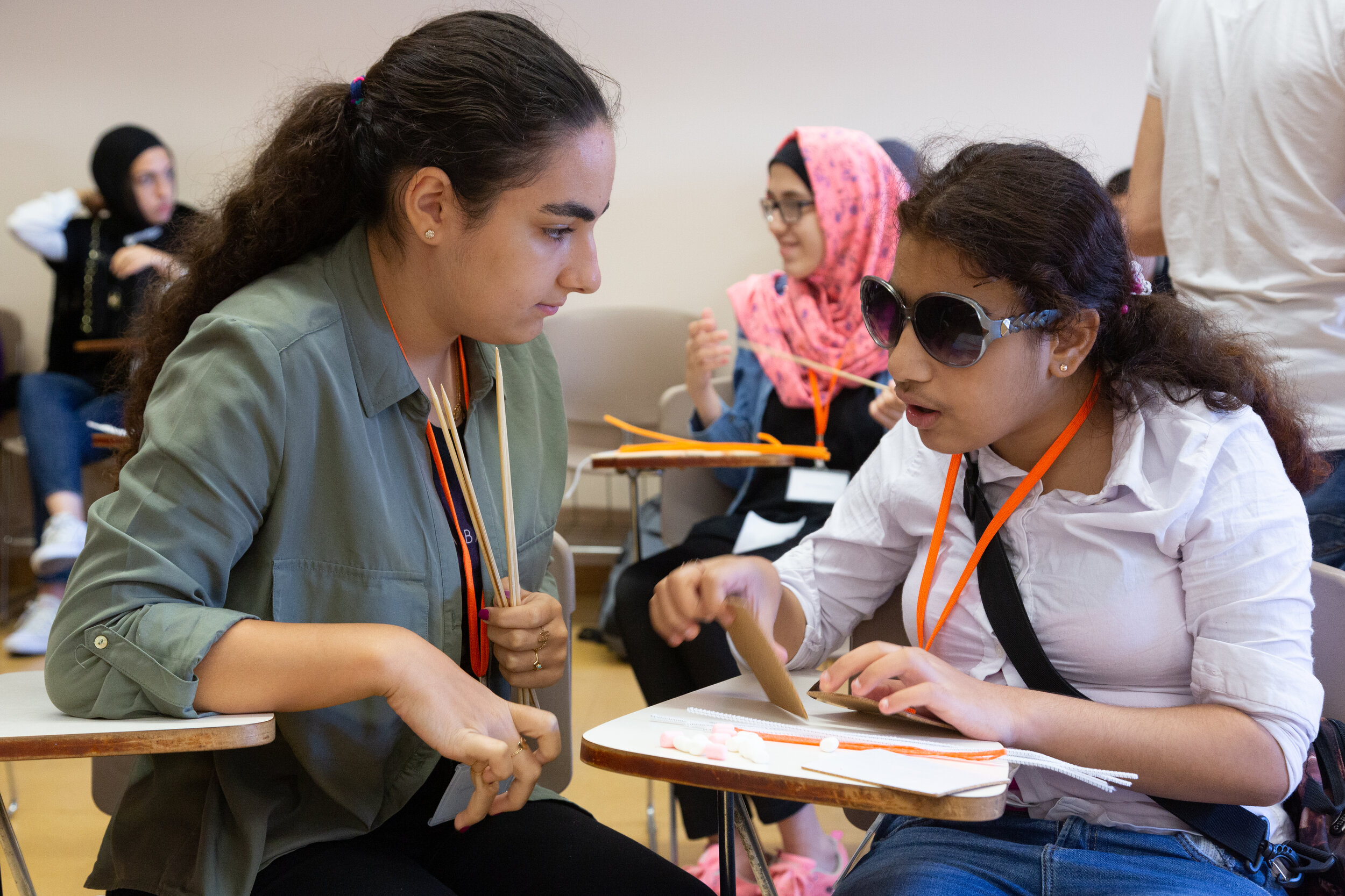 Volunteer and participant work together at a desk