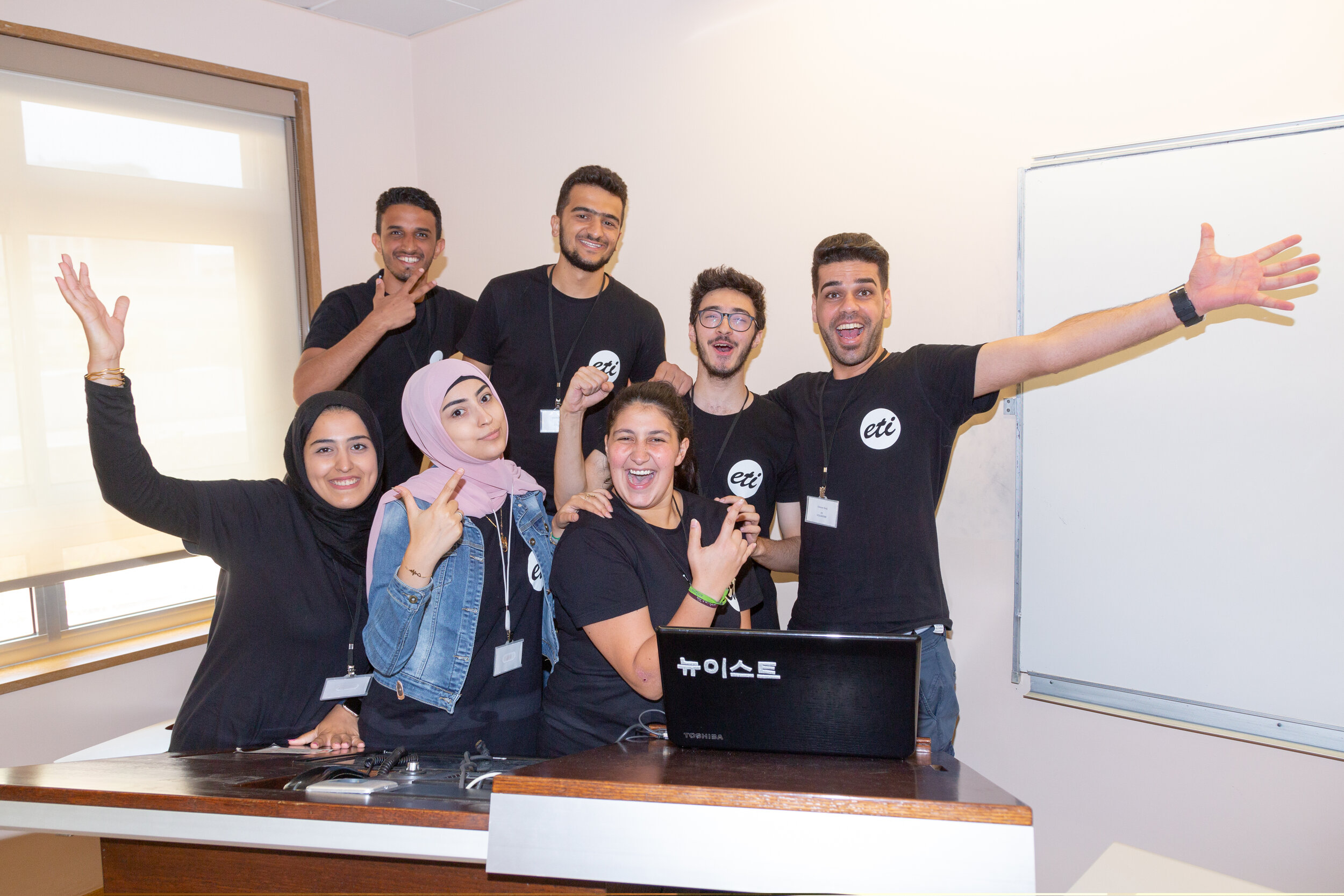 ETI volunteers pose cheerfully for the camera
