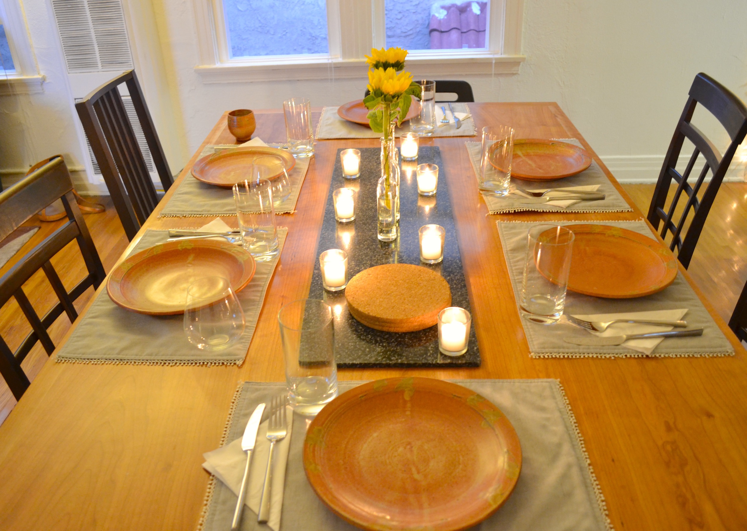 How gorgeous is this table? Our friend's father made it for her and her husband to use at their wedding. And the plates are pretty great too, right? All of the dishes and serving ware were actually made by my in-laws. 