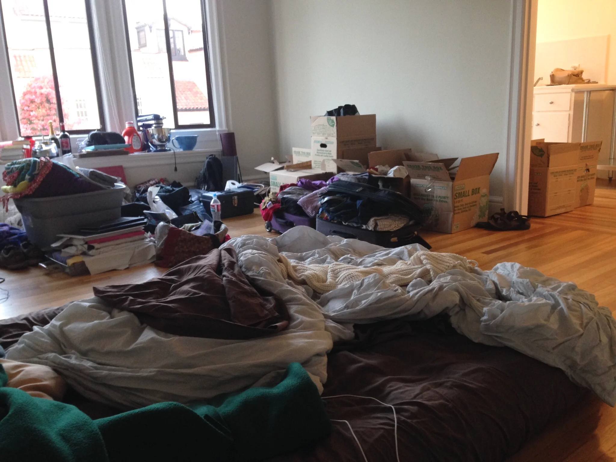 A never-shared-anywhere-else glimpse at the first day of unpacking in San Francisco. We didn't even have a real bed yet, that's an air mattress!