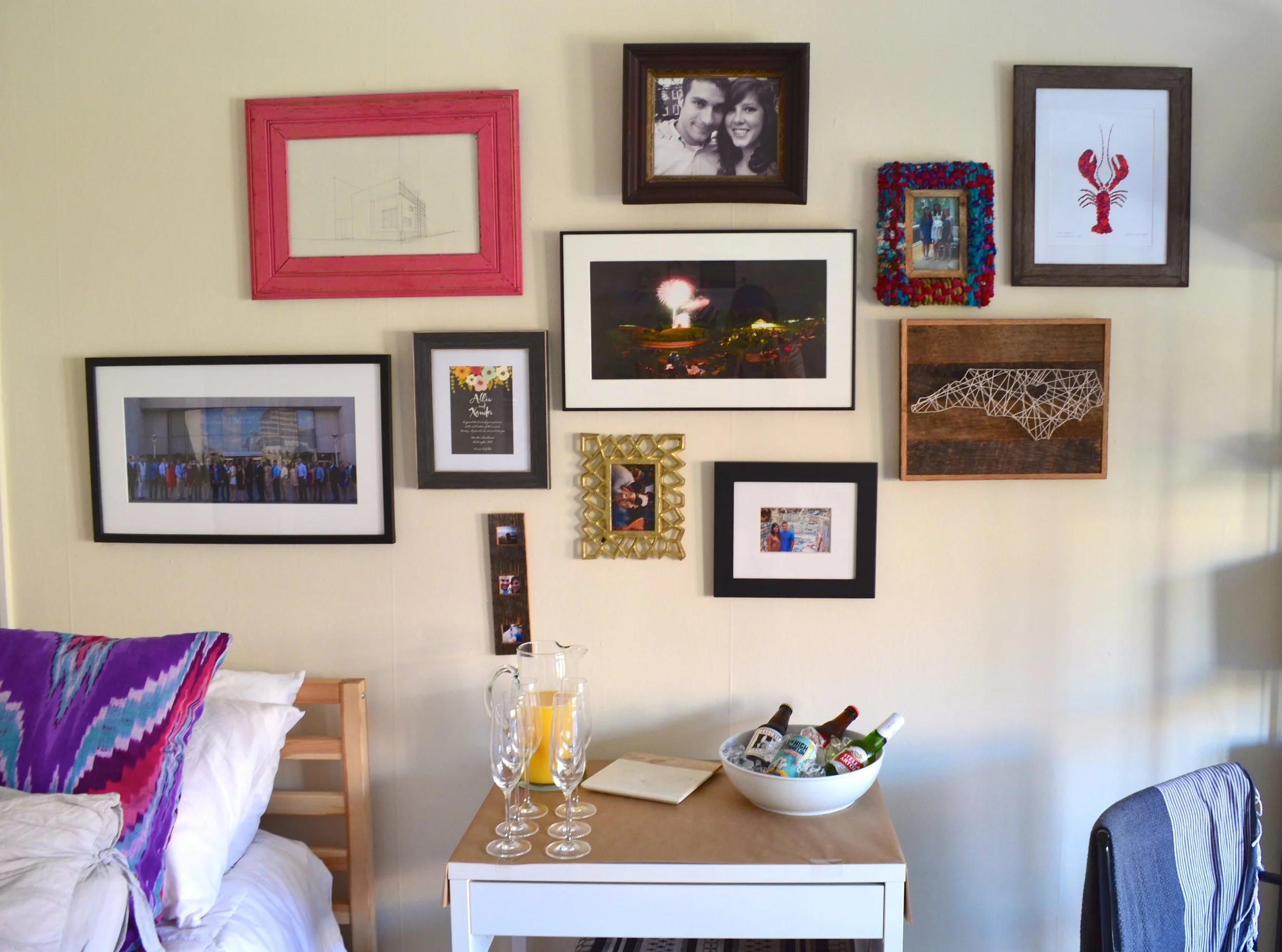 An up-close photo of (most) of that same gallery wall. The apartment was rearranged so we could fit 10 people when we hosted a wedding shower .