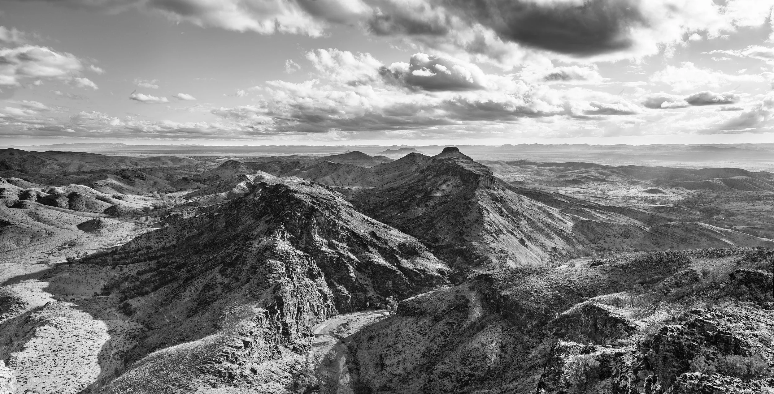 "GRAVITY" Landscape series. This series captures the raw beauty of the Flinders Ranges in South Australia and the confronting nature of its scale in time. With a geological history that is as old as complex life on earth, the landscape and it’s duration prompts us to explore the idea of our own brief flash of existence. The revolutions of our earth within the universe and the erosion of a prehistoric mountain range are created by the forces of gravity that act throughout our universe and show us the ever changing nature of life. This landscape and it’s context gives us a perspective far greater than our own short life and inspires. Buy Prints from this series.