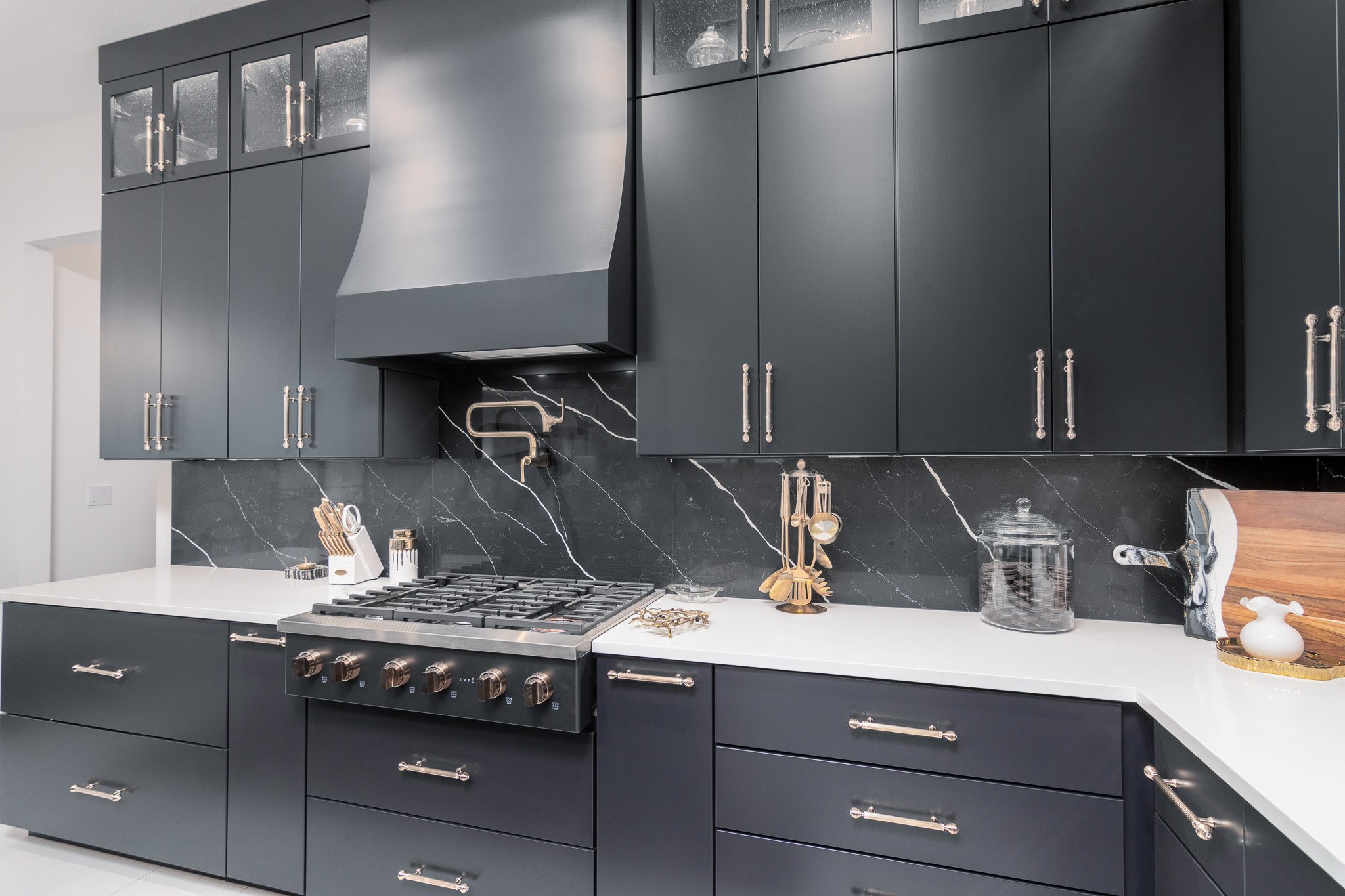 gas-stove-white-counter-black-cabinets.jpg