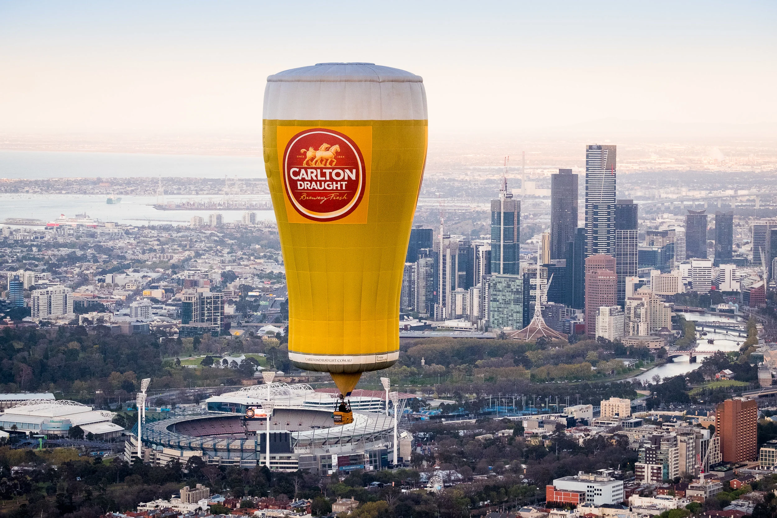 Carlton Draught Pot Balloon with the MCG and city in the background, shot taken from the Helicopter.