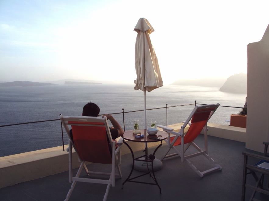 Santorini_reu on balcony_view of ocean.jpg