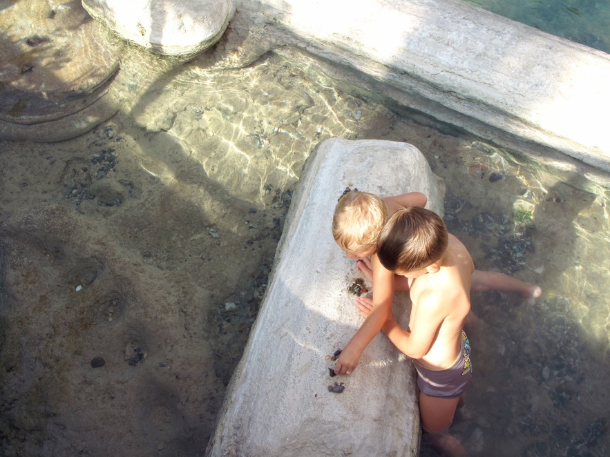 Pam_baths_little boys playing with rocks.JPG