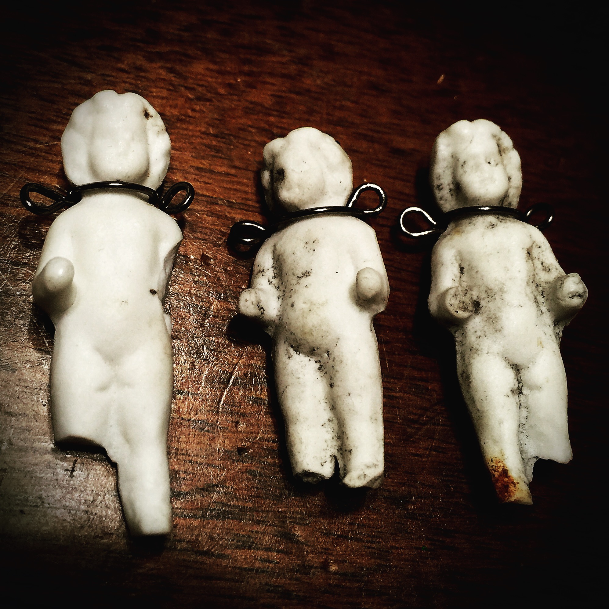 Frozen Charlottes waiting to become necklaces