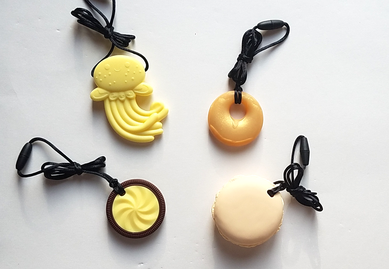 Clockwise from top left: Yellow jellyfish, gold annular, yellow macaron, lemon yellow cookie.