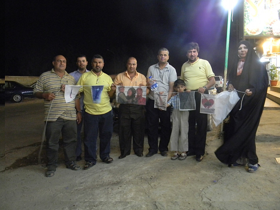 Fatin Al Jumaily displays Blown Derivatives in Karbala, Iraq photograph by Luke Wilcox of the Iraqi American Reconciliation Project, 2011