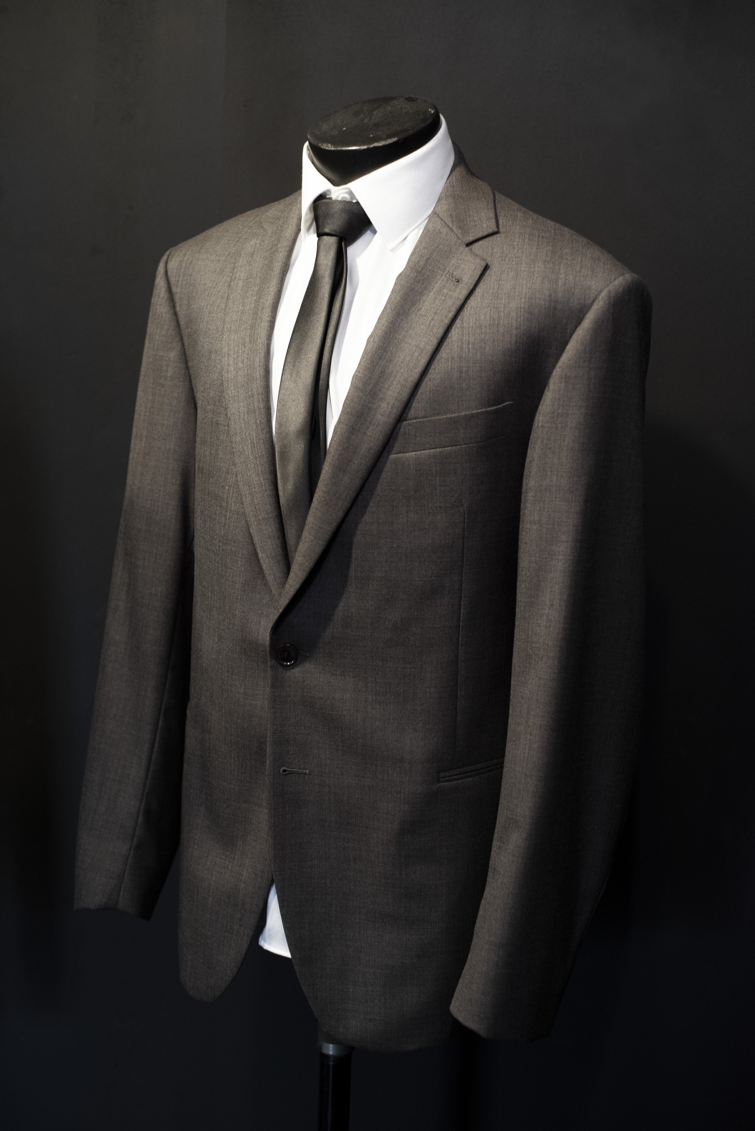 Medium Dark Gray Oaklawn Grey Suit for Rental in Tampa. Great for weddings, prom, homecoming and exclusively available for rent at Bib 'N Tux.