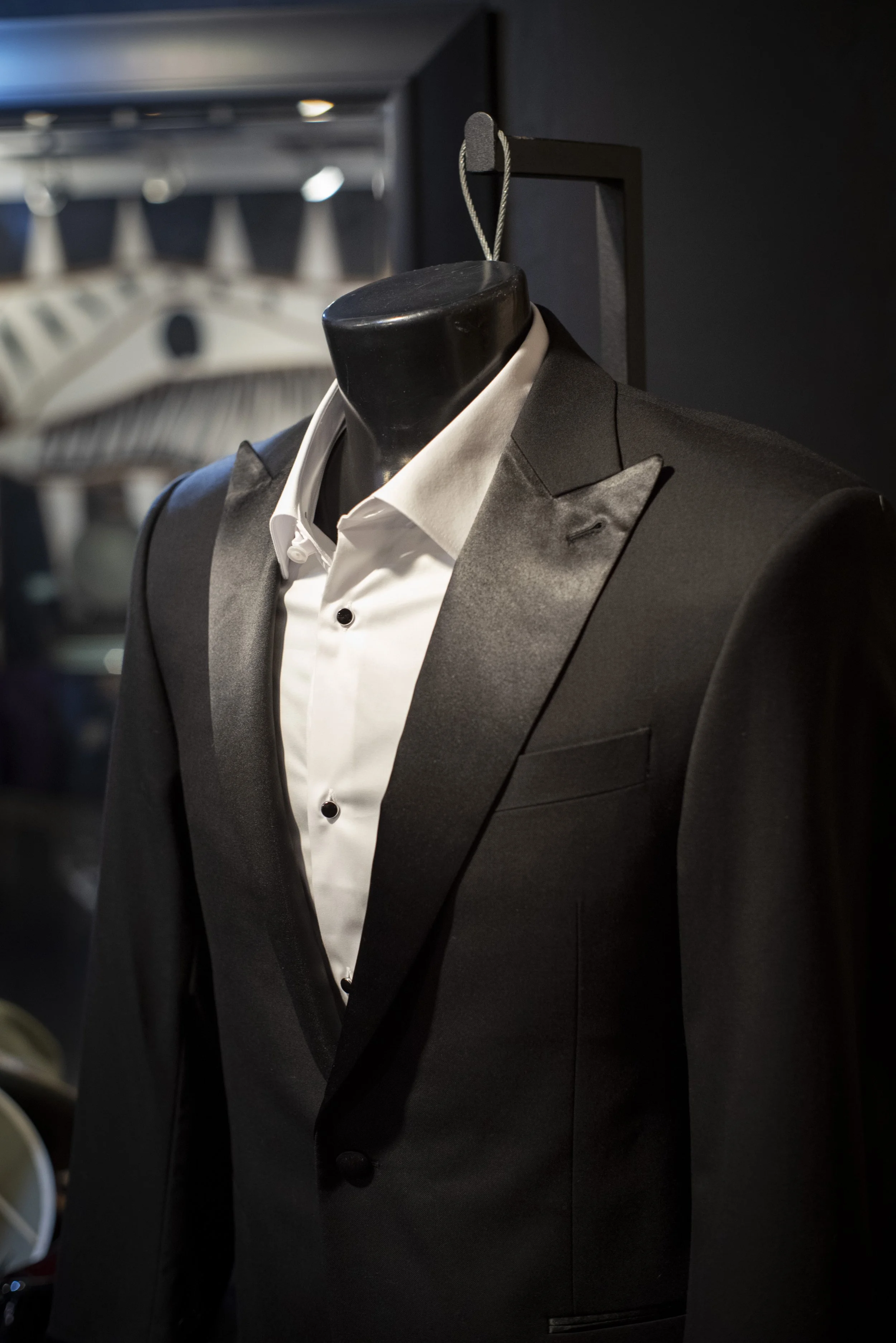 Tuxedo suit rental near me in Tampa at Bib 'N Tux by 1942 Clothiers. Black peak lapel tuxedo.