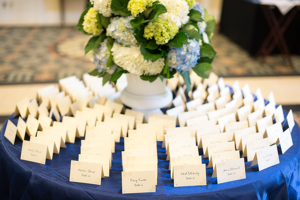 Here is the Card Table. we did a full navy overlay on this table so the stationary would really pop within the display, and a large oversize lush hydrangea urn to be the focal point as gusts walk in