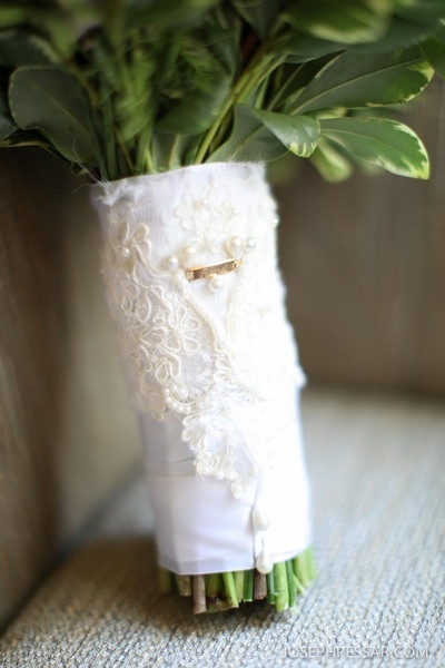 We did a custom bouquet wrap with lace from the bride's mother's dress and a plaque from the bracelet the bride wore on her Christening, I love doing this because it really adds a personal touch to the bride's bouquet.
