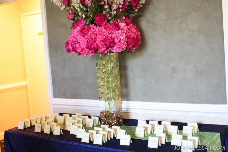 Card Table Piece, at the entrance to the ballroom the guests were greeted with an oversize topiary in hot pinks and greens, I like doing an exaggerated card table piece because I feel it really sets the tone for the even before the guests walk into the reception room.
