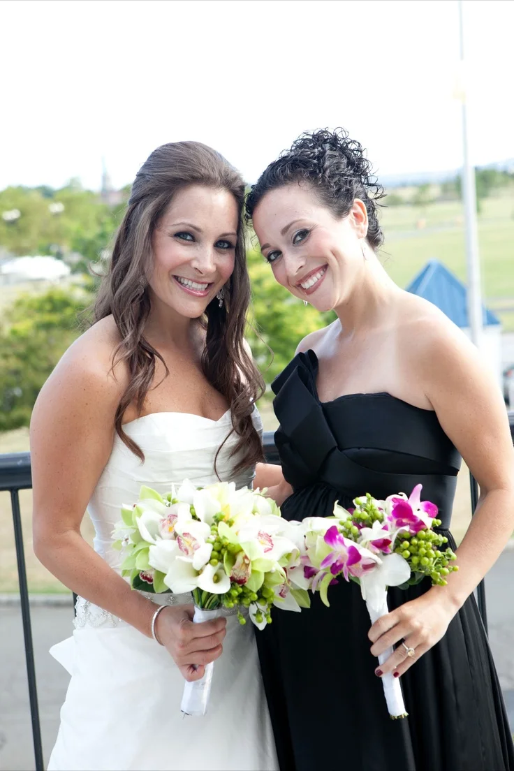 We made a smaller version of the bride's bouquet for the bridesmaids, using the purple dendrobian orchids instead of the white cymbidiums to give more color to the bouquets and pop off the black dress.