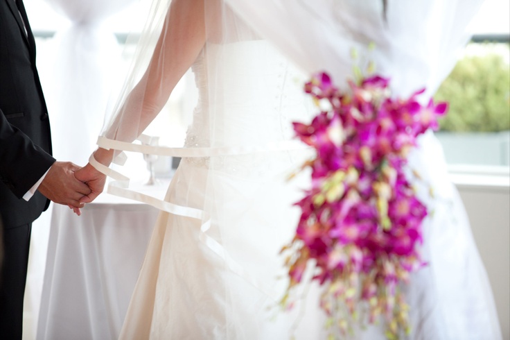 Simple dendrobian orchid ties help highlight the "perfect" structural look to the Chuppa design