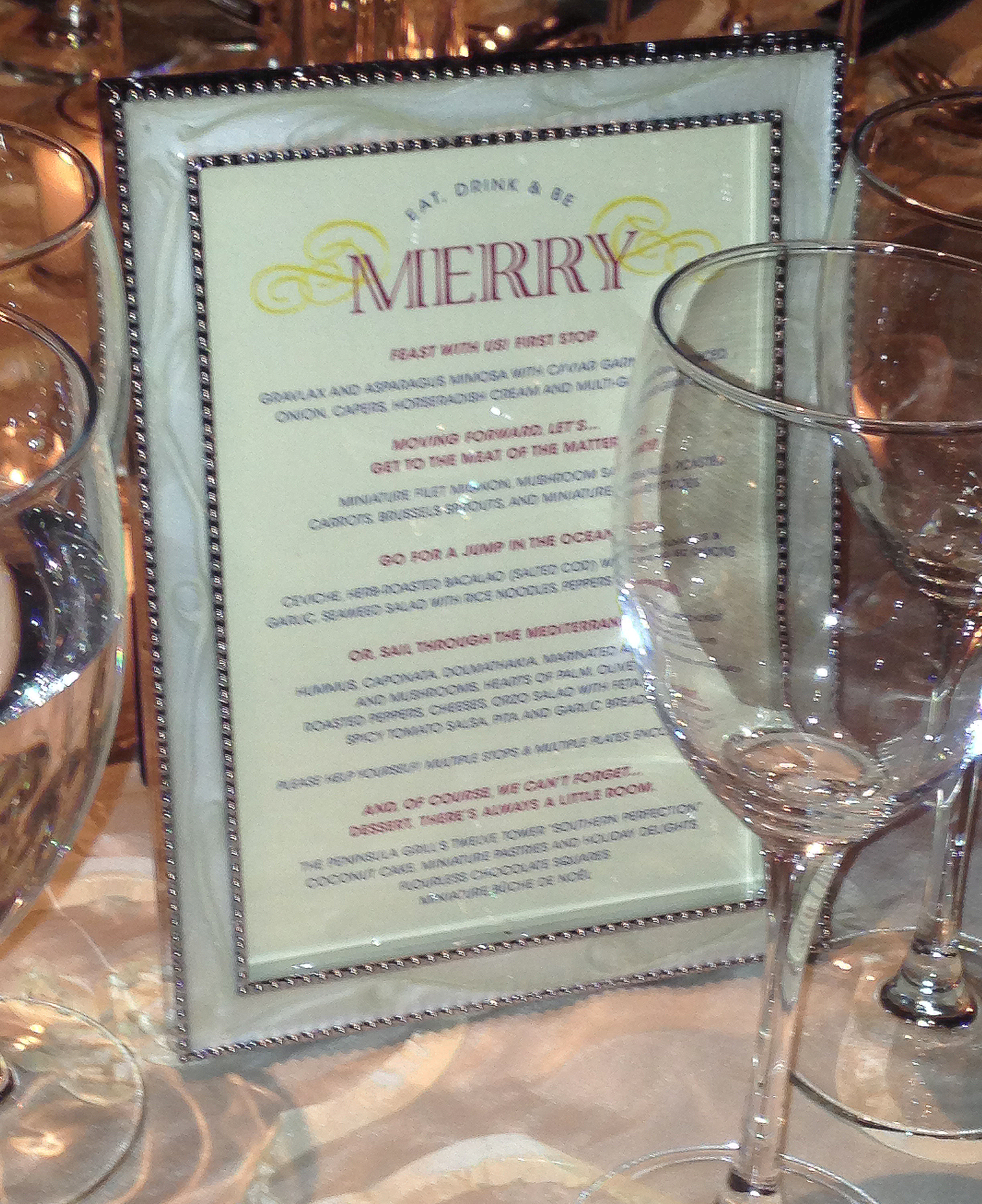 Menu cards displayed in beautiful frames at guest’s tables to inform them of the delights that they are about to eat. The design carries the theme of the other wedding materials through to complete the ensemble of pieces. 