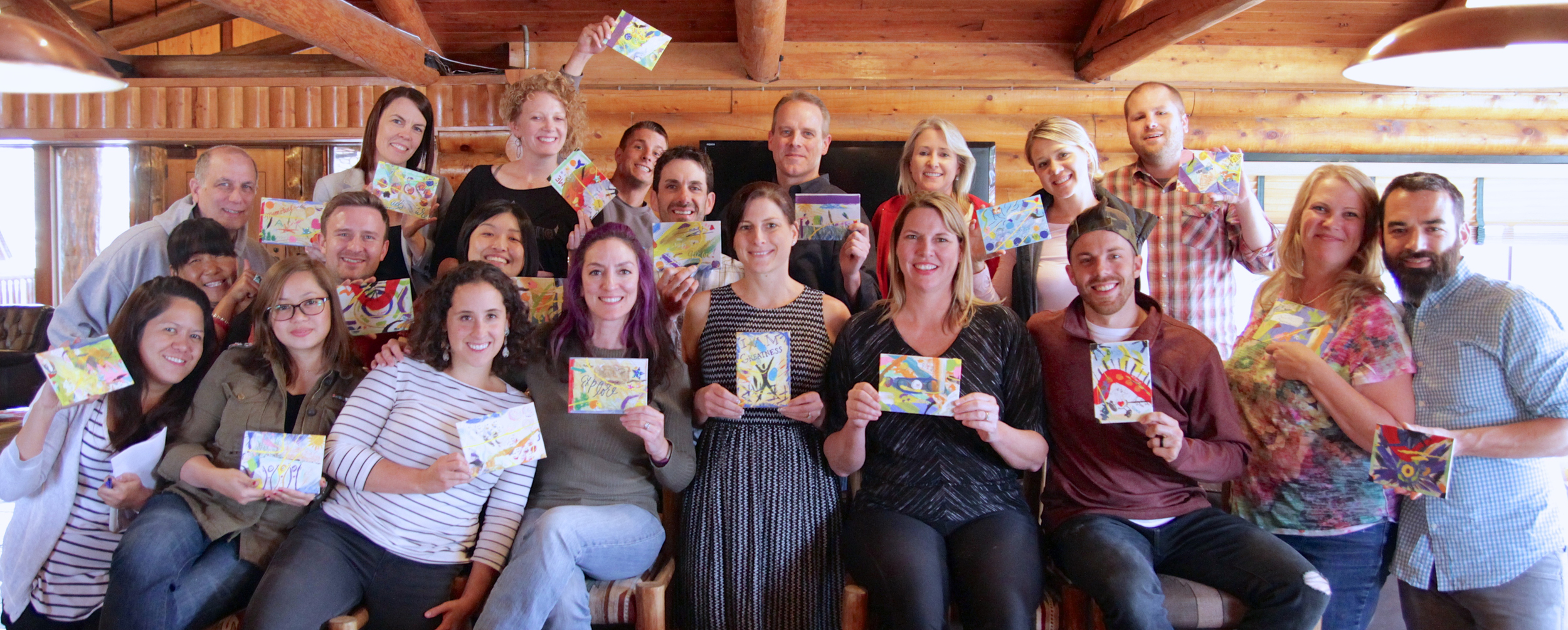 All attendees and facilitators proudly displaying our artistic canvases that we created as a brilliant group effort being lead by the amazing Ellen Watkins and her creativity workshop.