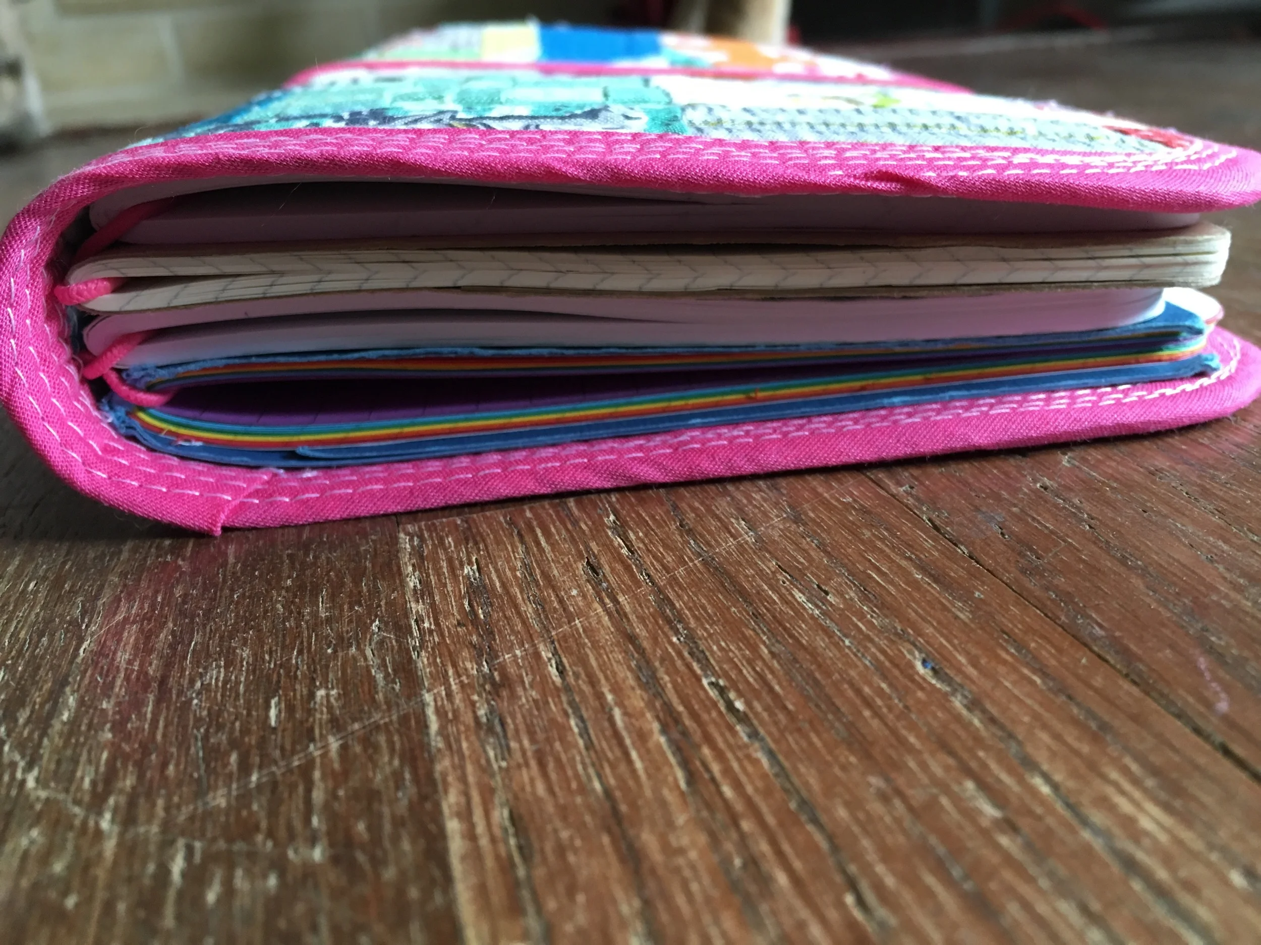 I put in 4 book elastics so it can easily hold moleskine Cahiers, May Designs notebooks, and my own homemade books