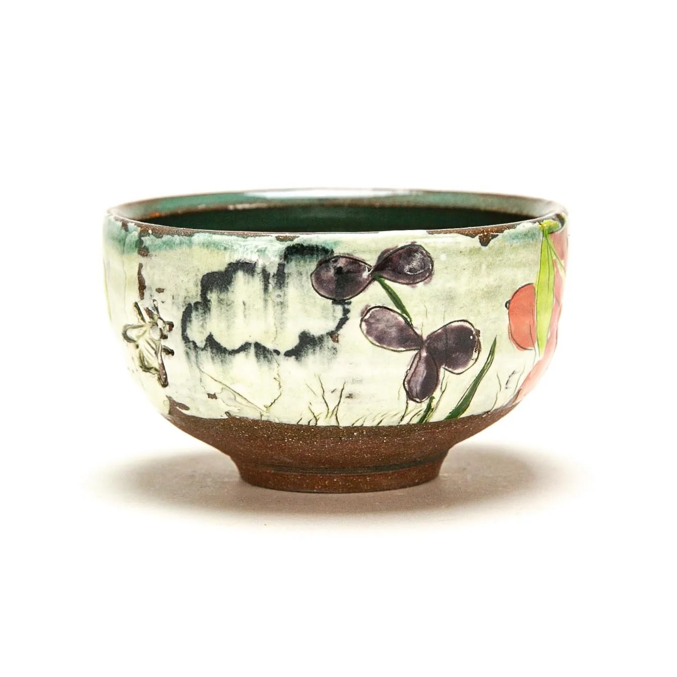 Tea Bowl: Red Stoneware with slip and underglaze. ^5 Oxidation