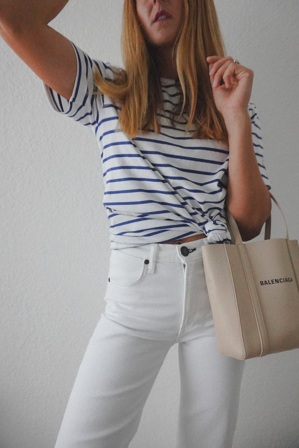  Jessica Ashley wearing white denim, striped t shirt and Balenciaga handbag outfit idea with Balenciaga xxs tote  