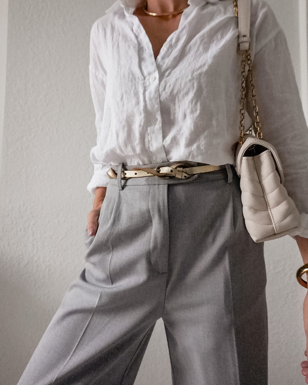  Jessica Ashley wearing Linen blouse with grey trousers and gold belt | linen blouse outfit ideas | click to shop this look 