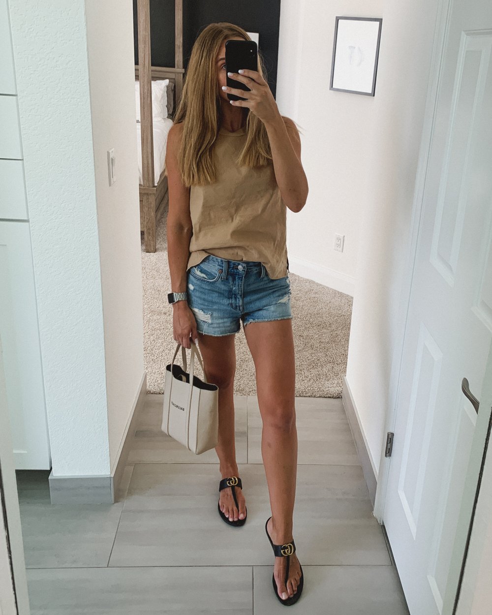  Jessica Ashley wearing Gucci Marmont Sandal outfit with denim shorts, neutral linen tank with Balenciaga bucket bag crossbody | outfit inspiration summer outfit 