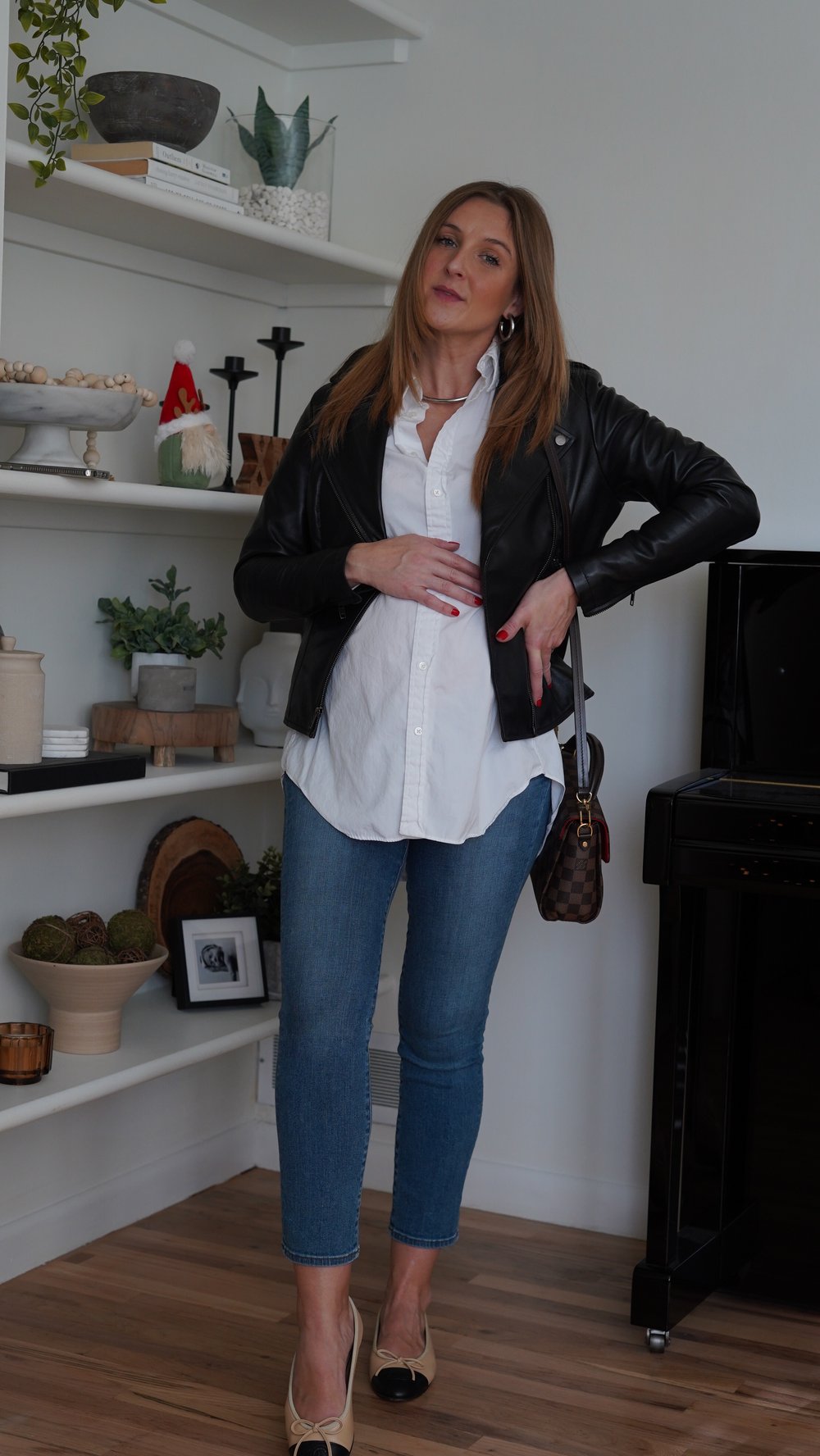  Jessica Ashley wears The Jacket Maker Flashback leather jacket in size XS with JBrand maternity denim,  Chanel logo flats, white blouse and Gucci Dionysus small cross body bag | best leather jackets for women 
