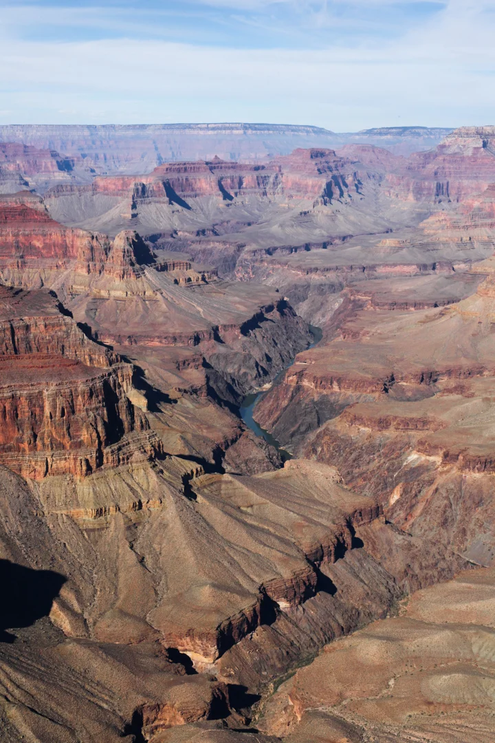 Colorado River seems so tiny and tame, yet is the power carving out the landscape through millions of years of erosion.