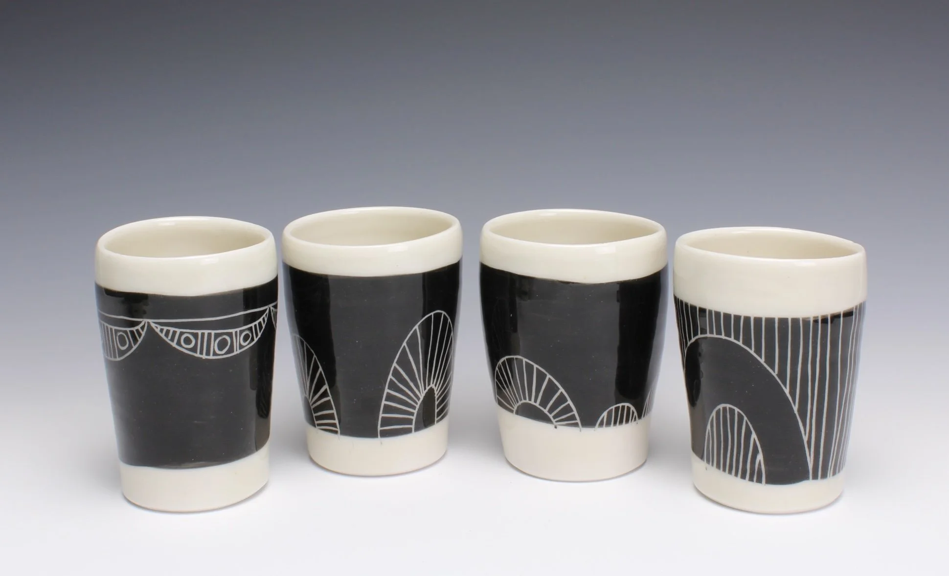 Small porcelain cup with black and white pattern — Dowd House Studios