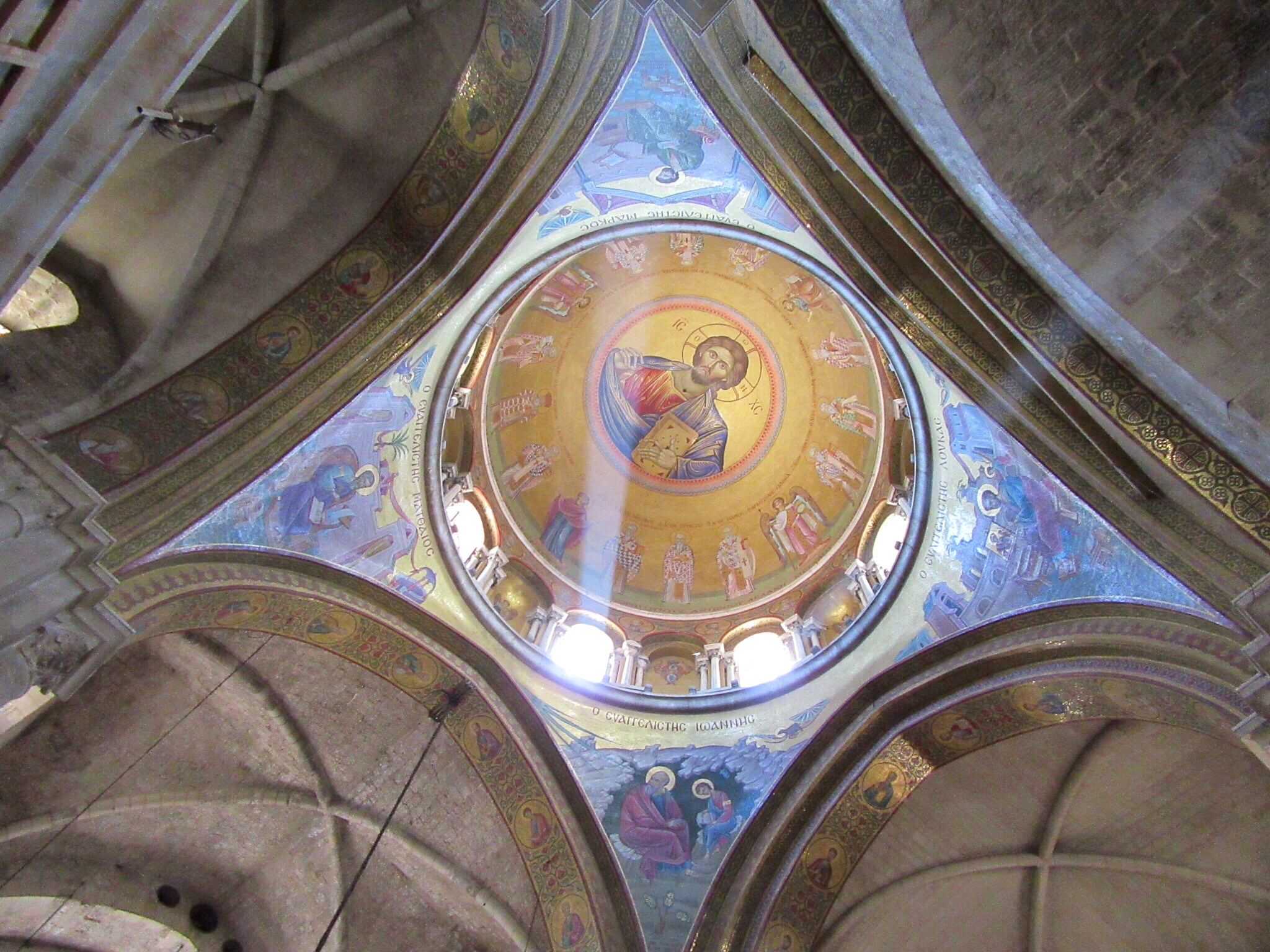 The Christ Pantocrator ceiling above the Catholicon in the center of the Church of the Holy Sepulchre. 