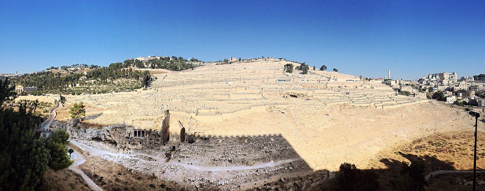 And sets on the thousands of graves on the slopes of the mountain.