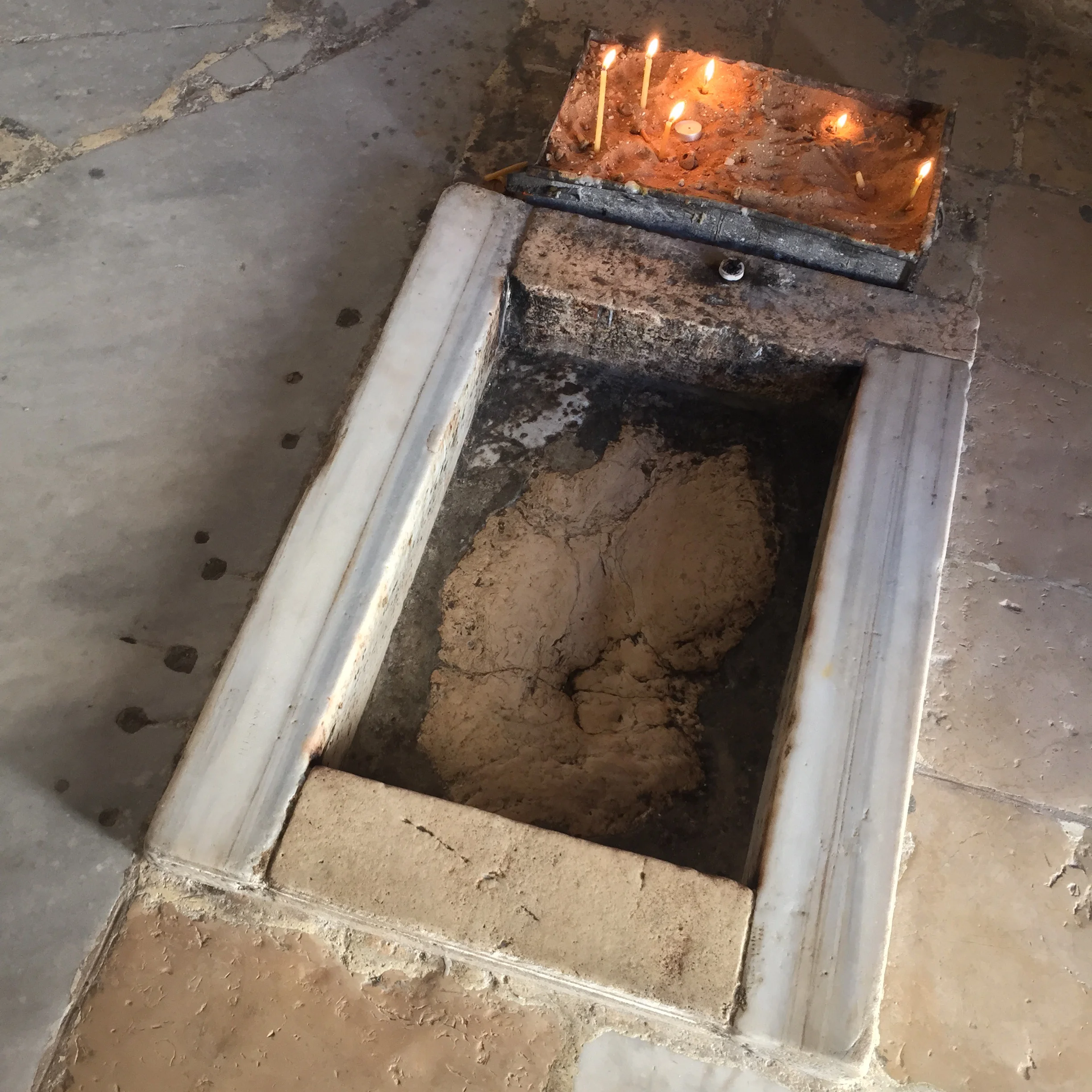 What remains of the footprint, picked away by pilgrims over the centuries.