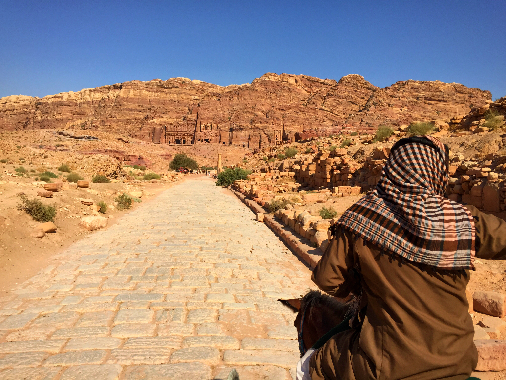 Bedouin guide leading along the Roman colonnade.