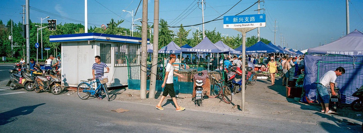  August 5, 2018, Shanghai, China - Late afternoon crowd at a market on  Changxing Island. 