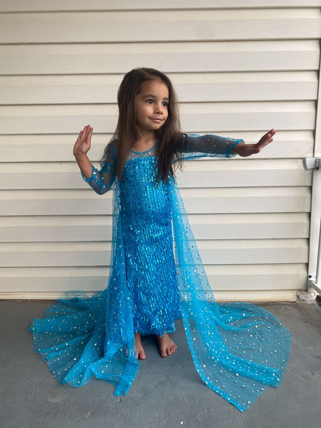 Young girl dressed as princess from the movie Frozen