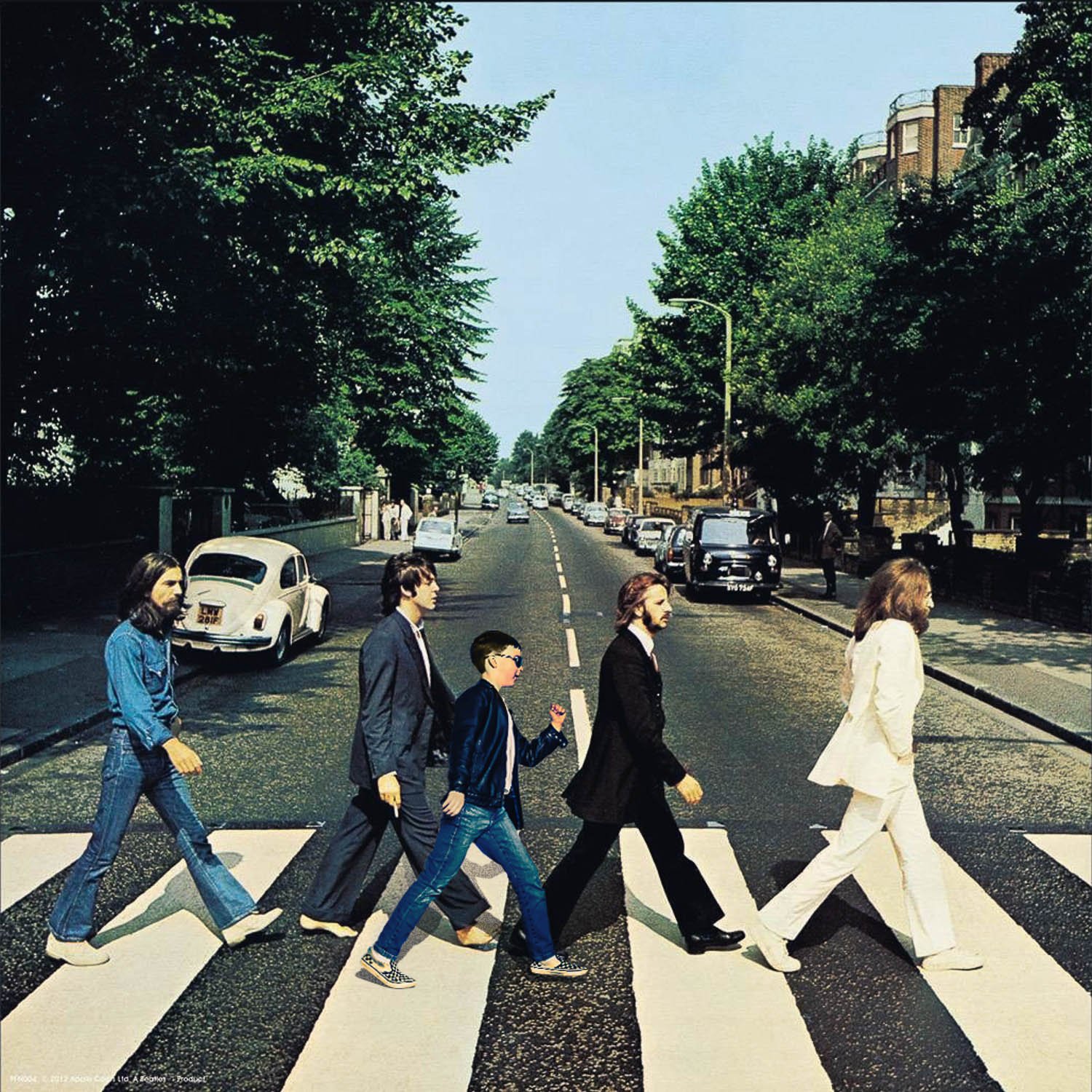 A young boy walking with The Beatles in Abbey Road album cover