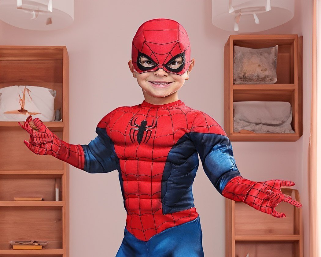Young boy in bedroom wearing Spiderman costume
