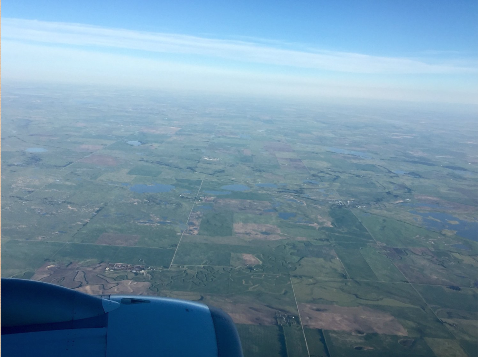 igure SEQ Figure \* ARABIC 3 . A photo of the landscape taken from 2-miles up in the air. Roads are distinguishable but houses are difficult to pick out.
