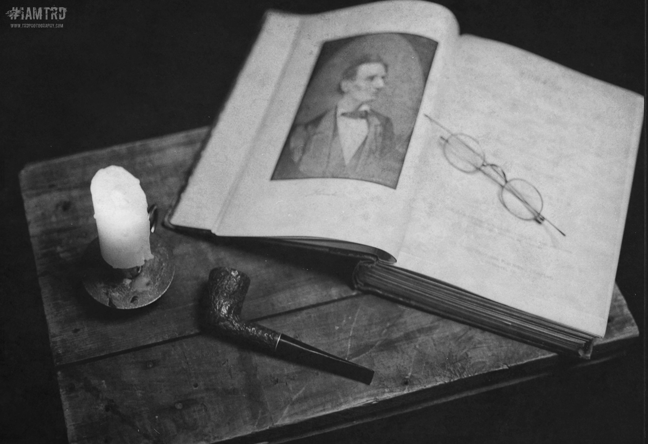 Still Life Photo of Abraham Lincoln book with mens pipe and candle - Kodak Tri X Film Photography - Photographer Ricky Davis of TRD Photography