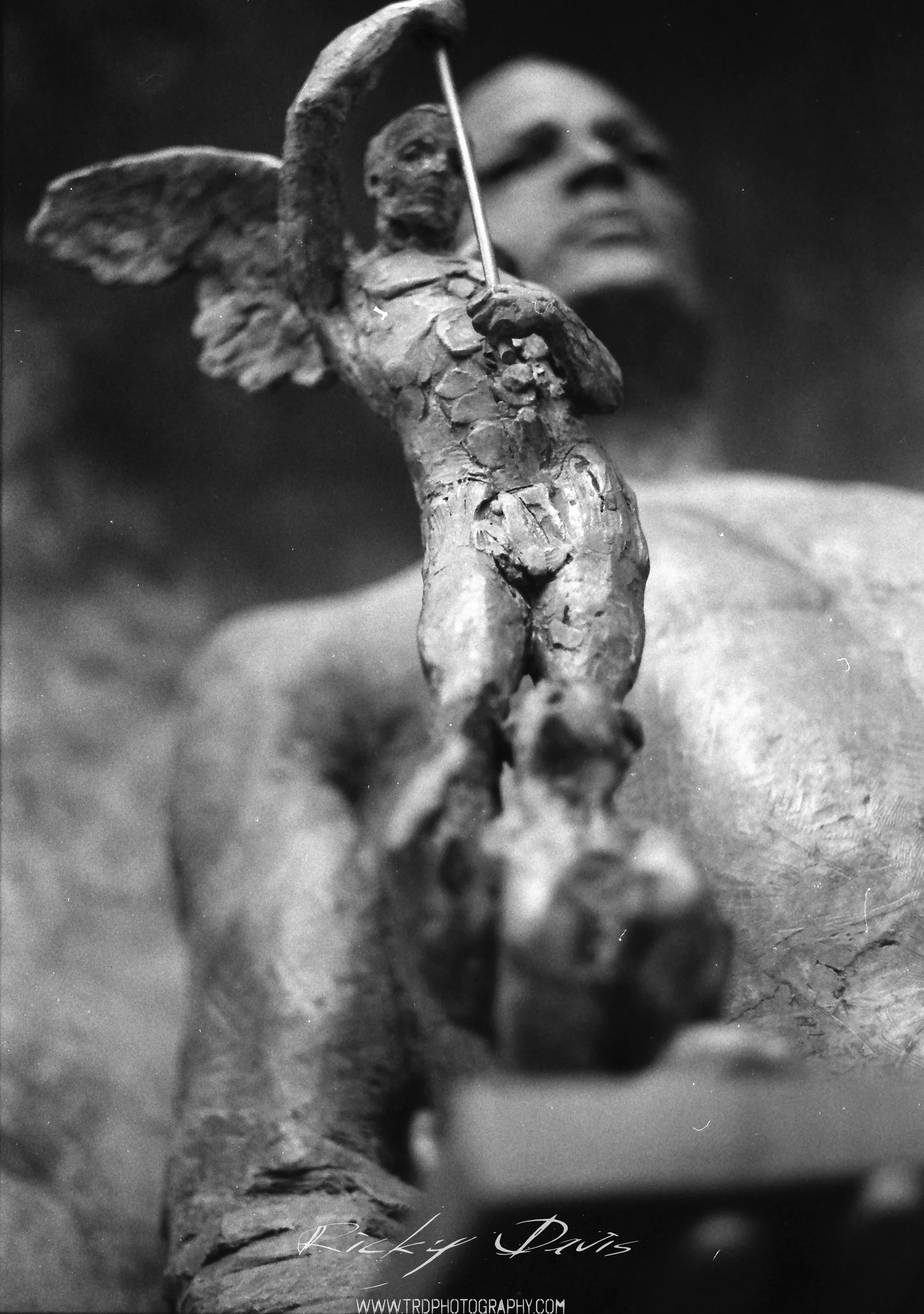 "Sometimes you have to look up, just to see hell" From a different angle.. Sculpture in Chattanooga, TN - Film - Expired Neopan SS - Camera - Minolta XG 1 - Photographer Ricky Davis